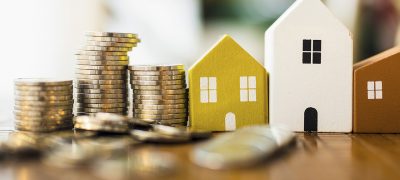 Wood,House,And,Row,Of,Coin,Money,On,Wood,Table Wood house and row of coin money on wood table and , selective focus, Planning to buy property. Choose what's the best. A symbol for construction ,ecology, loan concepts.