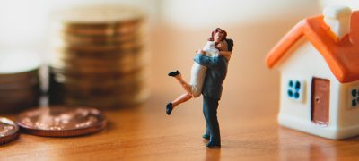 Miniature,People„Man,And,Woman,Sitting,With,Stack,Coins,And Miniature people, man and woman sitting with stack coins and mini house using as job retirement, family life and insurance concept